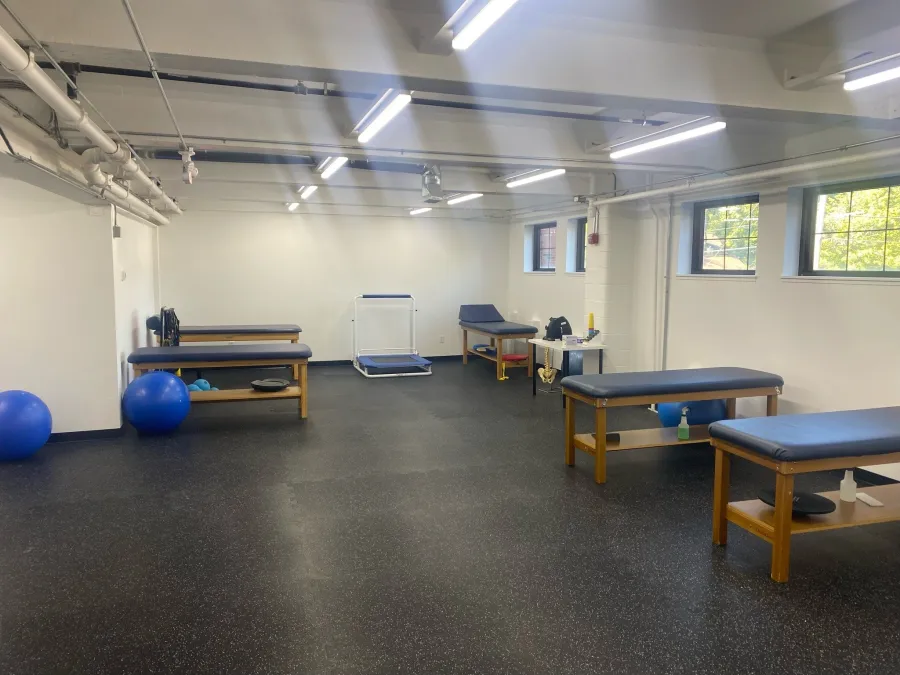 Treatment tables and exercise balls inside the Hopkinton clinic